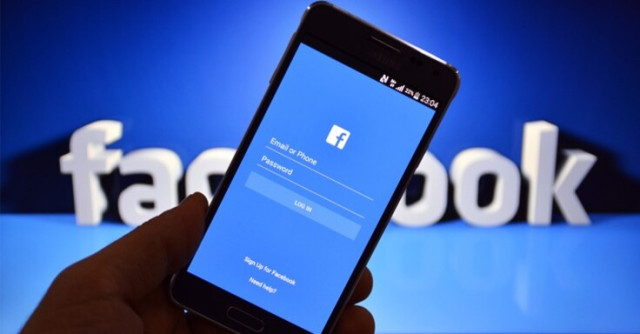 Facebook Logo Behind Facebook Login Portal on a Smartphone Device